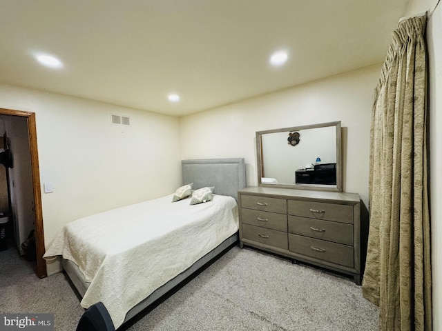 carpeted bedroom featuring recessed lighting and visible vents