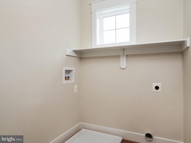 laundry area with laundry area, hookup for a washing machine, and electric dryer hookup