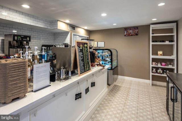 kitchen featuring recessed lighting, visible vents, baseboards, and white cabinetry