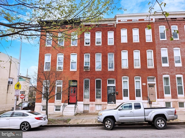 townhome / multi-family property with brick siding