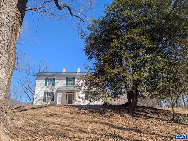 view of front of property featuring a chimney