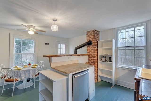 kitchen featuring a ceiling fan, open shelves, refrigerator, wood finished floors, and light countertops