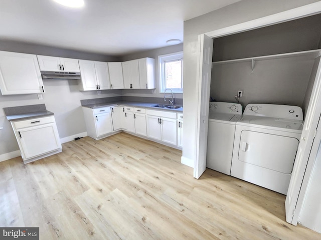 681 Fayette St, Cumberland, MD 21502 - laundry room with washing machine and clothes dryer, laundry area, light wood-style floors, and a sink