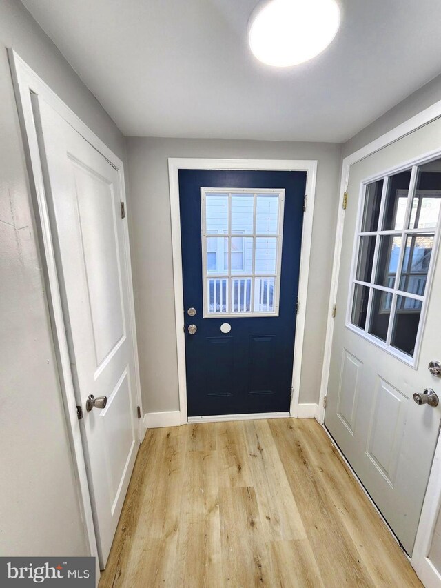 681 Fayette St, Cumberland, MD 21502 - doorway to outside featuring light wood-type flooring and baseboards