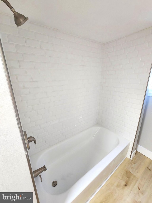 681 Fayette St, Cumberland, MD 21502 - bathroom with shower / tub combination and wood finished floors
