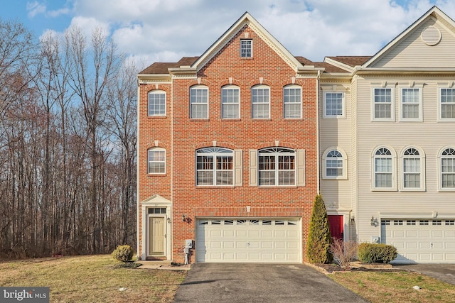 107 Persimmon Pl, Bear, DE 19701 - multi unit property featuring a garage, a front lawn, brick siding, and driveway