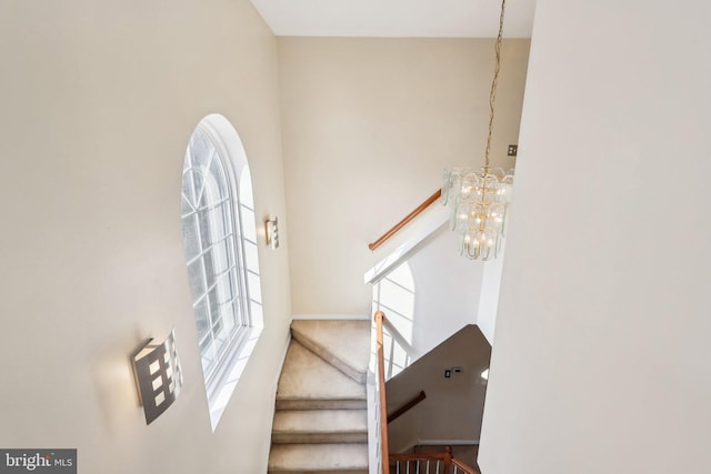 107 Persimmon Pl, Bear, DE 19701 - stairway with an inviting chandelier