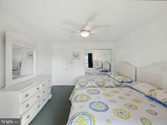 bedroom featuring a closet, a ceiling fan, and dark colored carpet