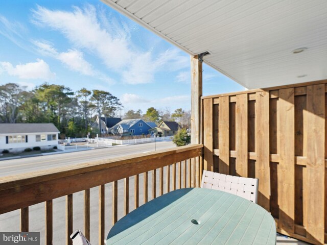 wooden deck with a residential view