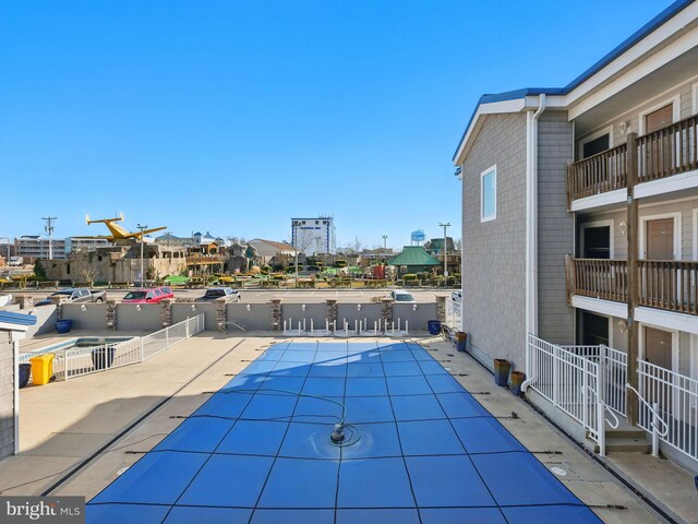 community pool with a patio