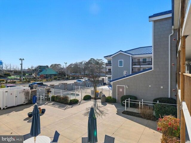 view of patio / terrace featuring fence