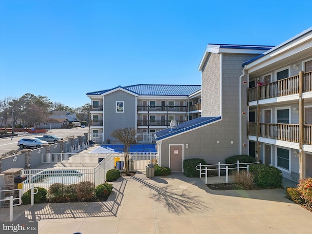 view of building exterior with fence