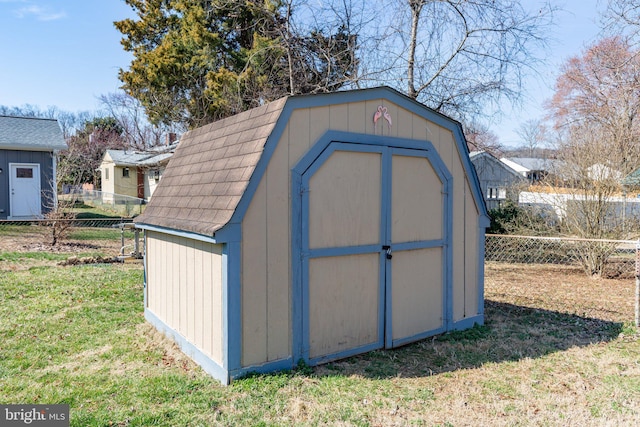 view of shed with a fenced backyard