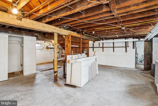 unfinished below grade area with separate washer and dryer