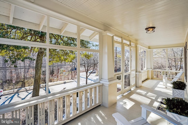 sunroom / solarium featuring a healthy amount of sunlight