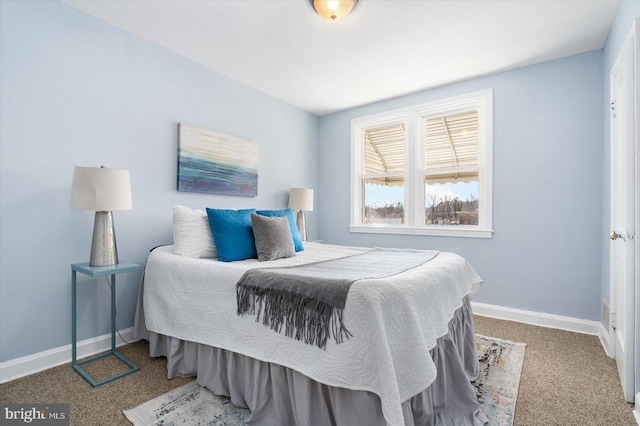 carpeted bedroom with baseboards