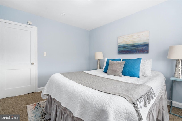 carpeted bedroom with baseboards