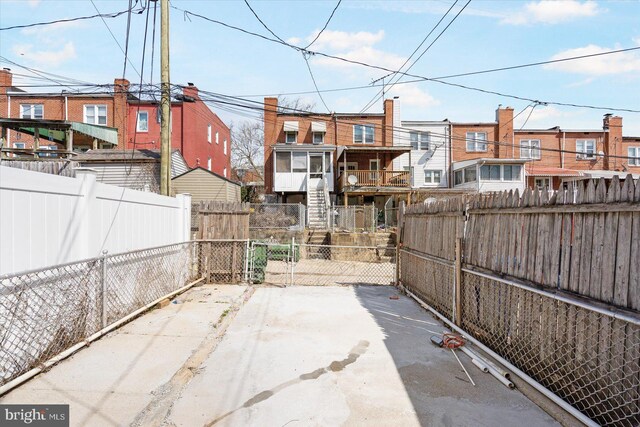 view of patio / terrace featuring fence