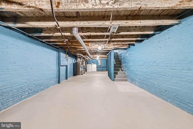 1712 N Washington St, Baltimore, MD 21213 - unfinished basement with stairway, washing machine and dryer, and water heater