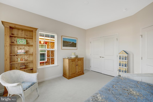 carpeted bedroom with baseboards