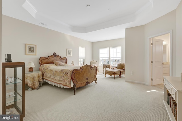 bedroom featuring visible vents, a tray ceiling, crown molding, baseboards, and light colored carpet