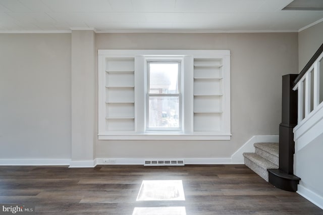 interior space featuring dark wood finished floors, visible vents, stairs, and baseboards