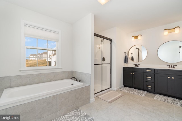 full bath with a shower stall, a garden tub, and a sink