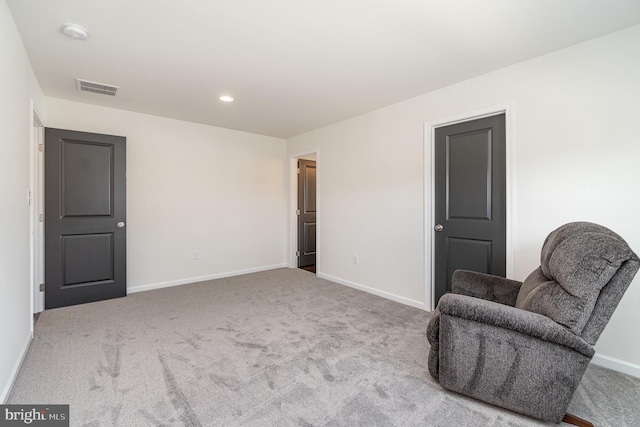 living area featuring recessed lighting, baseboards, visible vents, and carpet floors