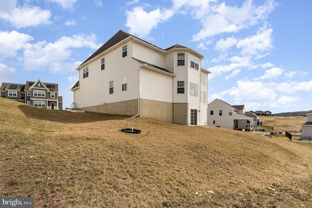 back of house with a yard