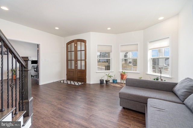 living area with recessed lighting, stairway, baseboards, and wood finished floors