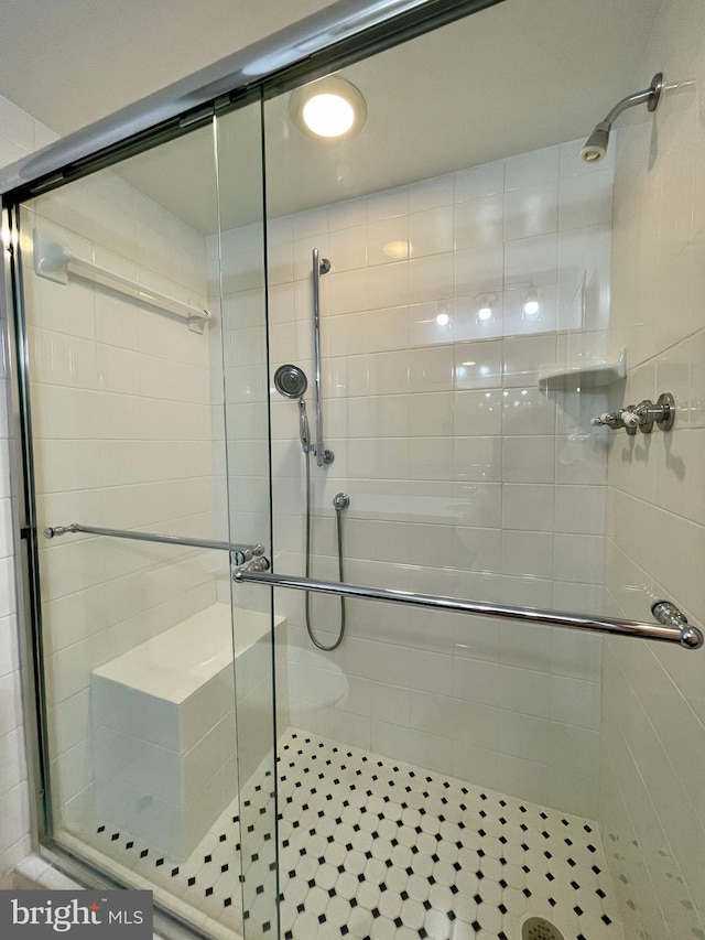 bathroom featuring a shower stall