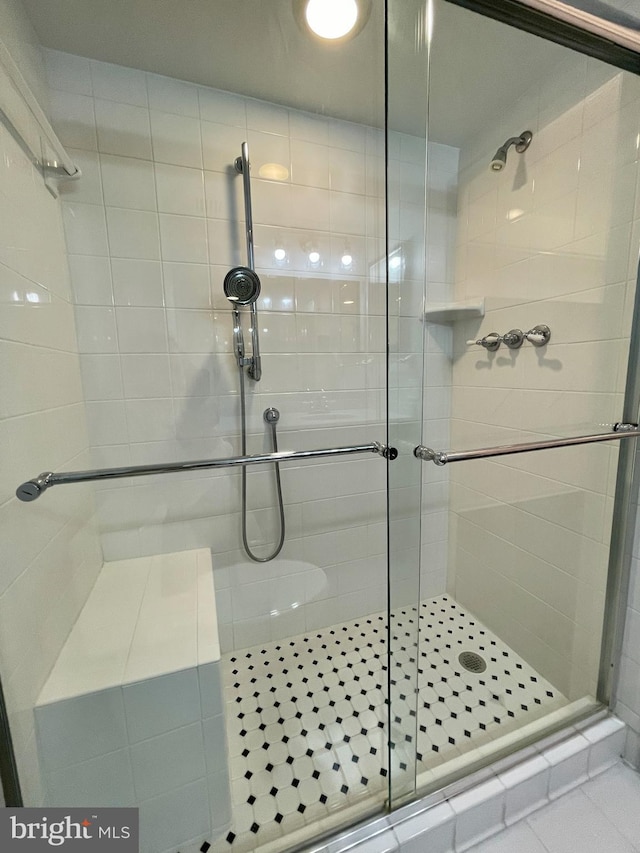 full bathroom featuring a shower stall