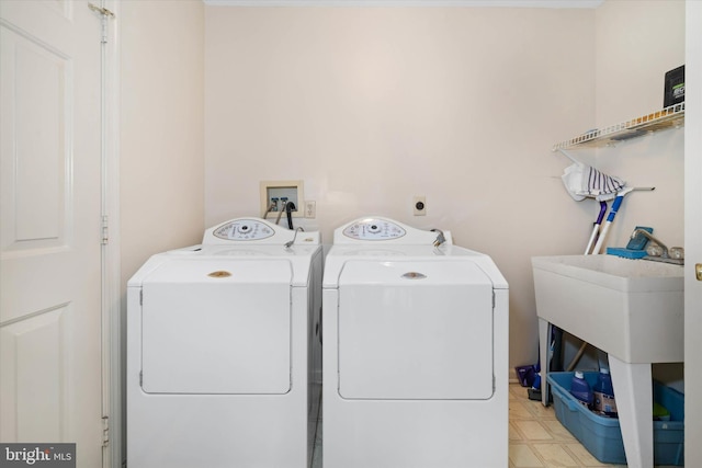 clothes washing area featuring laundry area and washing machine and dryer