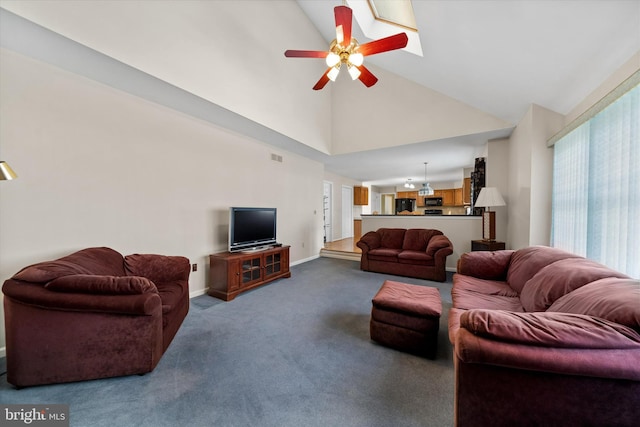 living area with high vaulted ceiling, baseboards, dark carpet, and ceiling fan