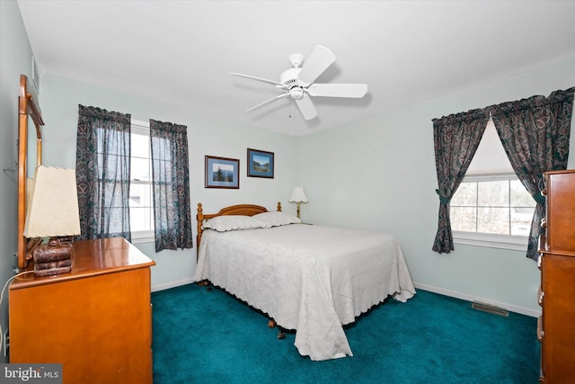 carpeted bedroom featuring a ceiling fan and baseboards