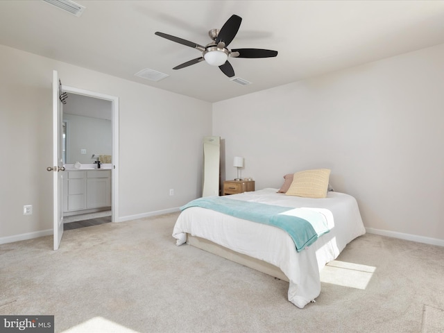 carpeted bedroom with visible vents, baseboards, and a ceiling fan