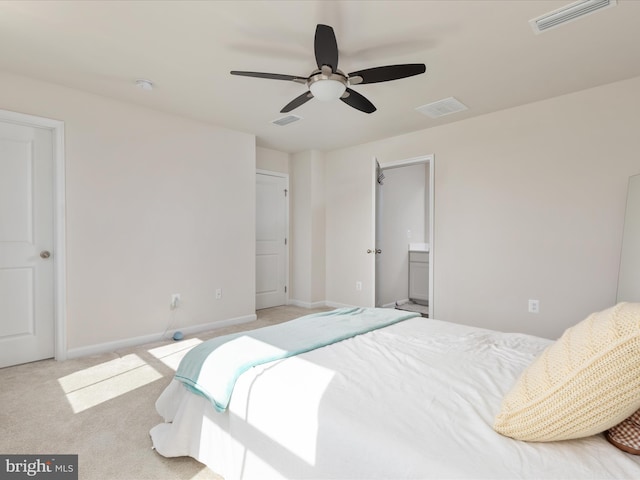 carpeted bedroom with baseboards and visible vents