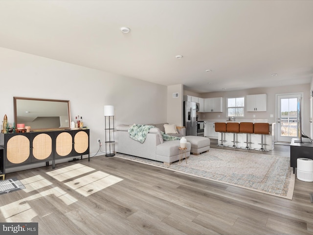 living area with light wood-type flooring