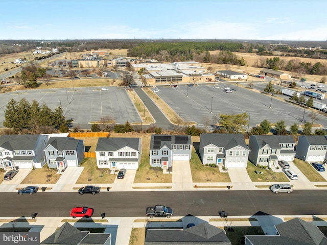 birds eye view of property with a residential view