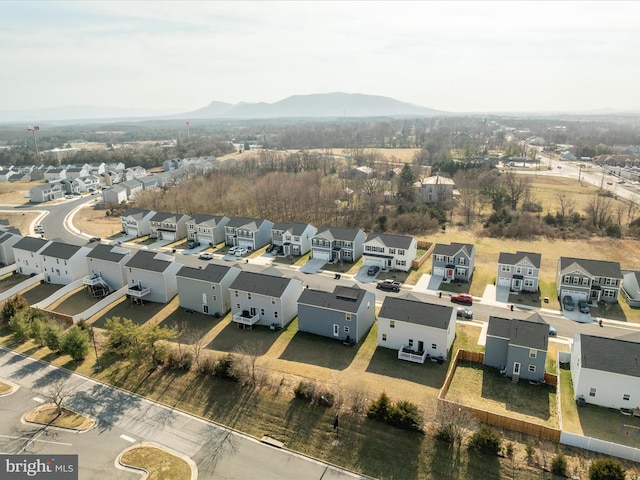 birds eye view of property with a mountain view and a residential view