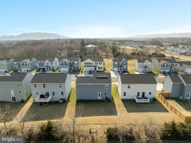 drone / aerial view with a residential view and a mountain view