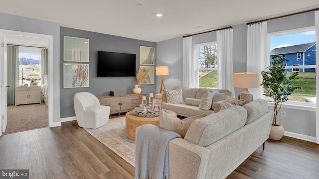 living room with wood finished floors and baseboards