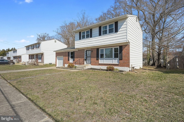 colonial home with a garage, driveway, brick siding, and a front lawn