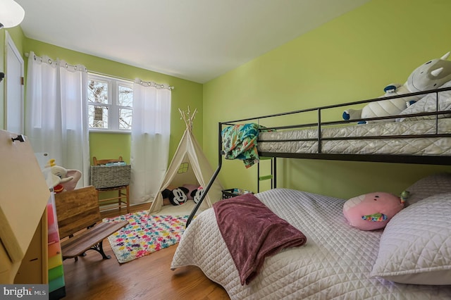 bedroom featuring wood finished floors