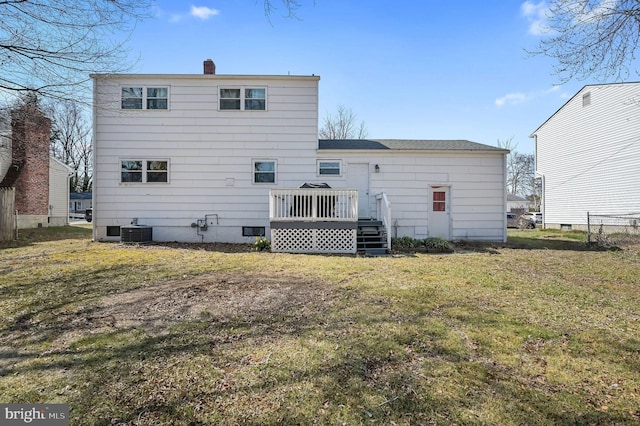 rear view of property with a yard, central air condition unit, a chimney, and a deck