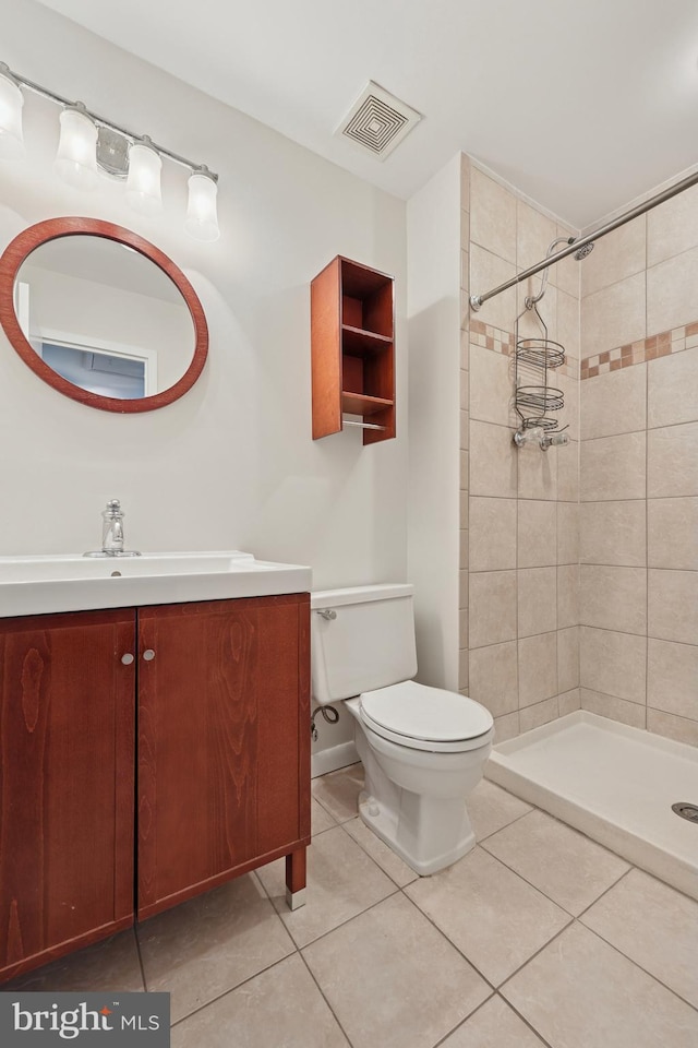 full bathroom featuring vanity, toilet, visible vents, and a stall shower