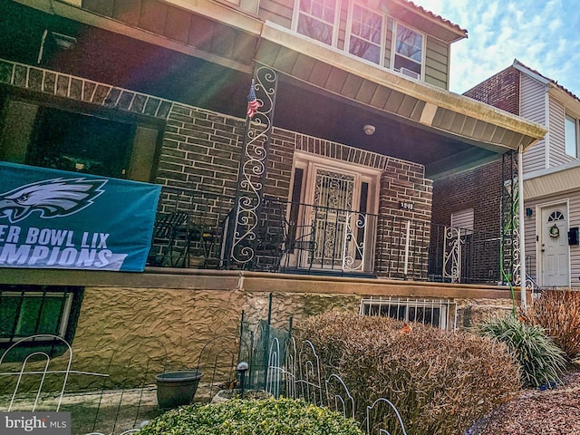 view of property exterior featuring brick siding