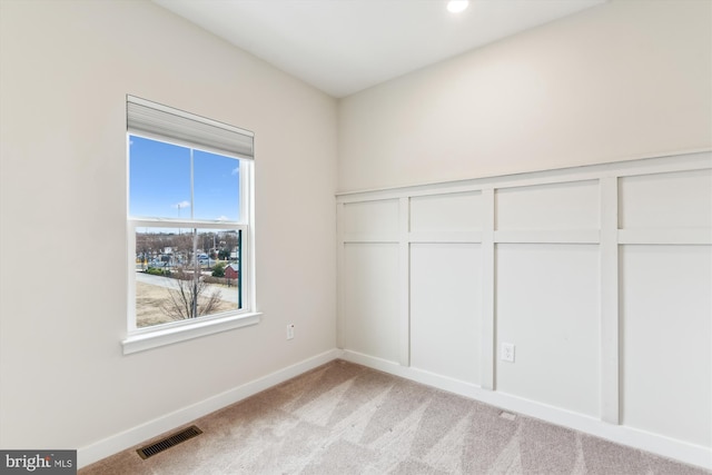 unfurnished bedroom featuring visible vents, recessed lighting, a closet, baseboards, and light colored carpet