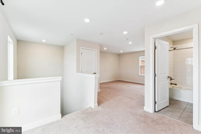 interior space featuring recessed lighting and baseboards