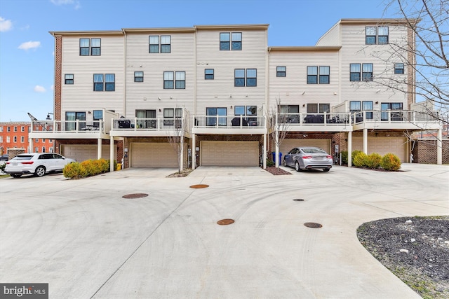 view of building exterior with a garage and driveway